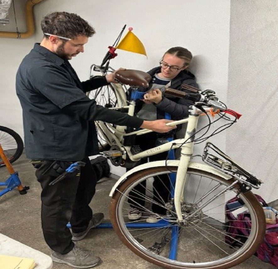 Mechanic Sam Storey and trainee mechanic Grainne Hennessy at a recent Bike Health Clinic at Genesys Cloud Services, Galway